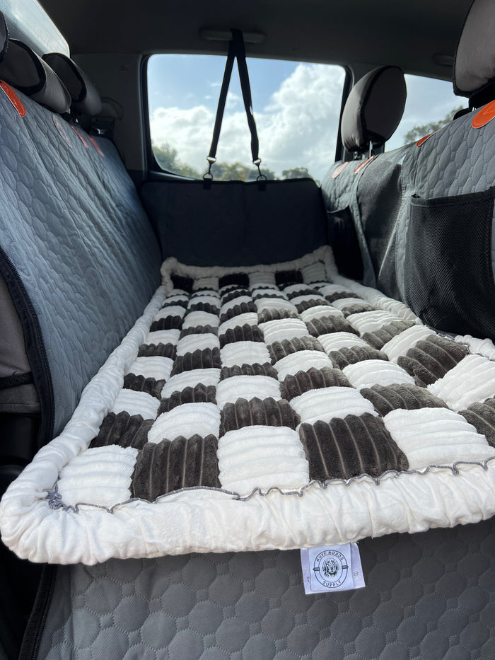 Black and white Snooze Cruiser car bed on The Top Dog seat cover