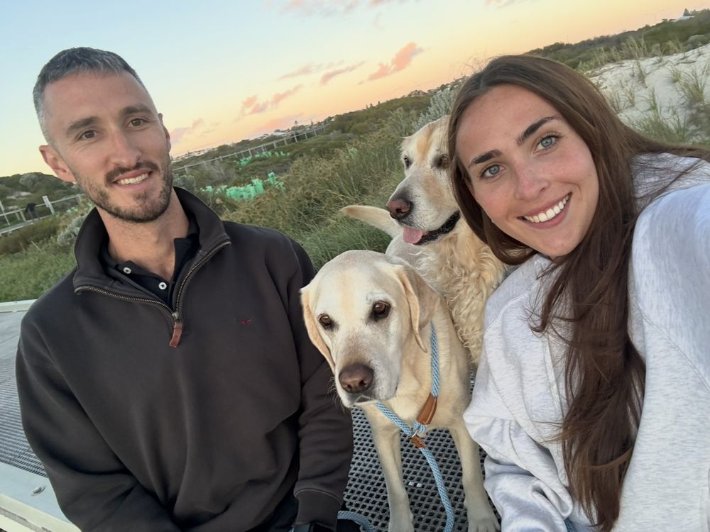 Cam and Brooke at the beach at sunset with Sushi and Soy